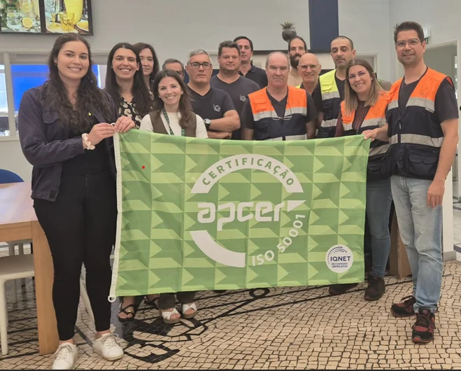 CRISAL employees holding the 50001 Certification flag